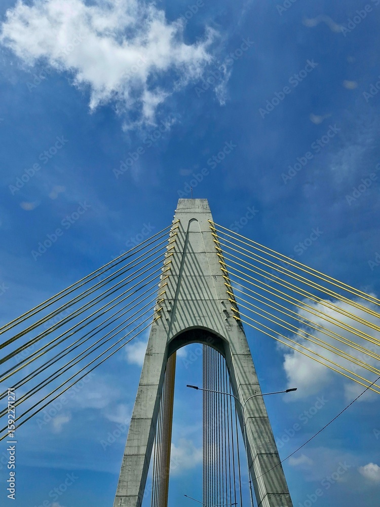 Fototapeta premium The end of a sturdy bridge support pillar