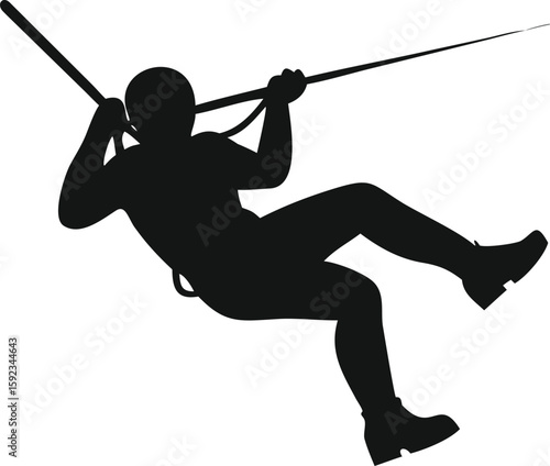 silhouette of a man climbing a rope