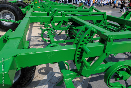 Agricultural machinery and parts of mechanisms on a sunny day. Texture, background for design. 