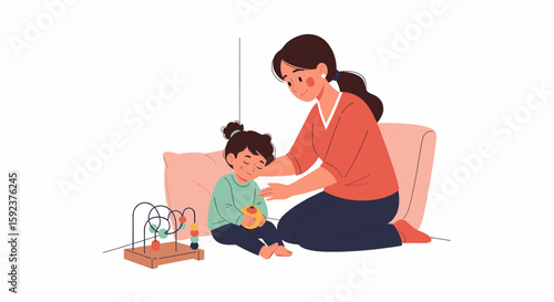A mother comforts her upset young daughter, sitting on the floor beside a wooden toy.
