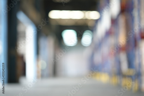 Wallpaper Mural Blur Spacious warehouse interior with organized shelving units and bright lighting. Clean, efficient environment ideal for logistics, cargo storage, and distribution center workflow. for background. Torontodigital.ca