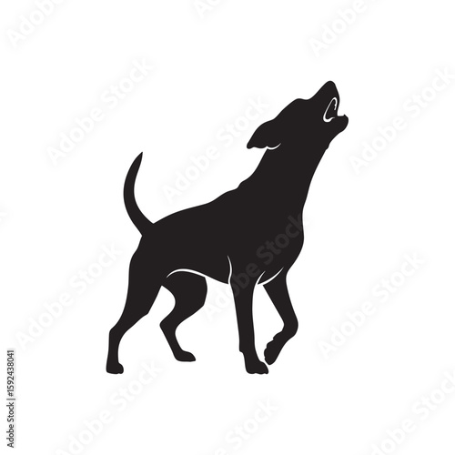 Silhouette of a dog howling or baying at the moon