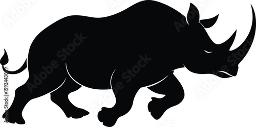 Rhino charging across savannah ,dynamic wildlife silhouette