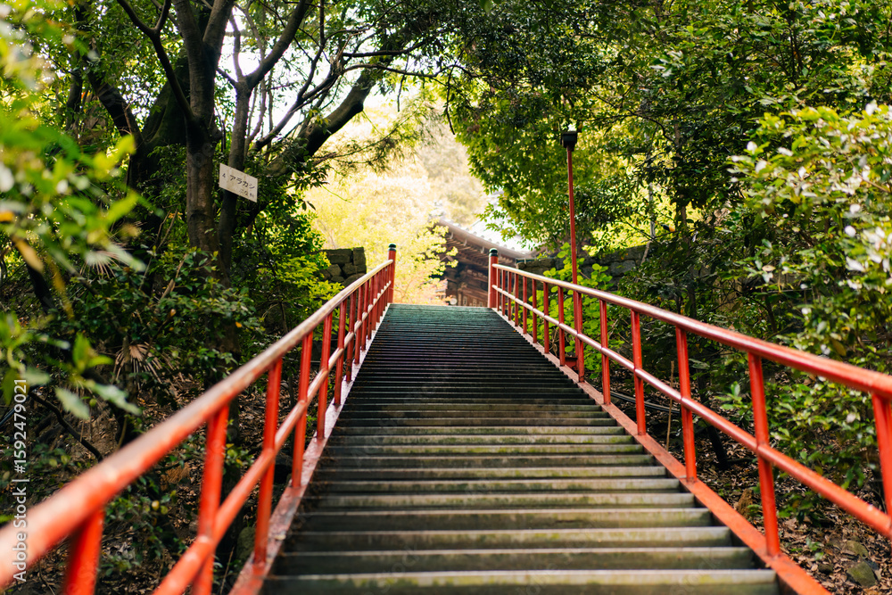 Obraz premium shikoku, JAPAN - may 2 2025 Iyadani Temple No. 71 Red Staircase in the Shikoku Pilgrimage