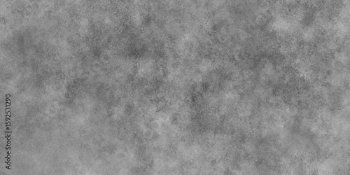 Abstract black and gray grunge background design. Some light shines .Paintbrush stroke textured cement or stone old background.