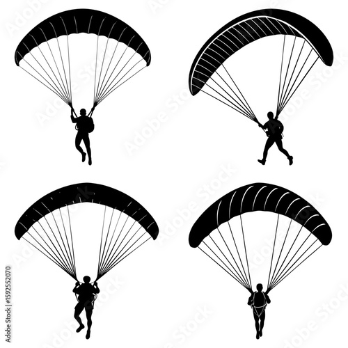 Four silhouetted figures engaged in the sport of paragliding against a bright white background scene view
