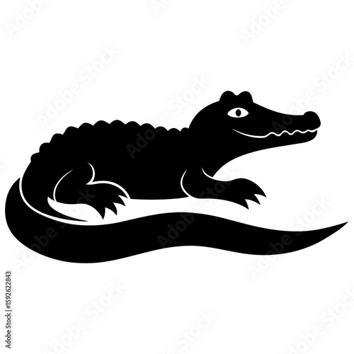 Silhouette of a crocodile resting on a riverbank