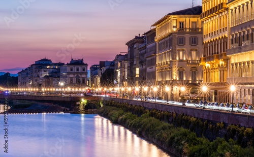 Florence at night on the banks of the Arno River, Italy