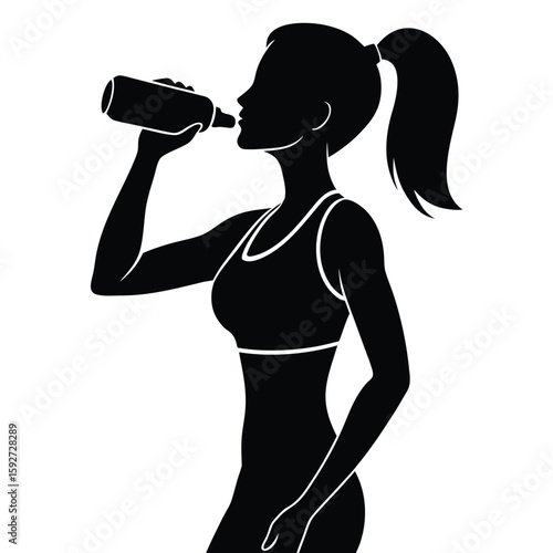 Athletic woman drinking from bottle silhouette