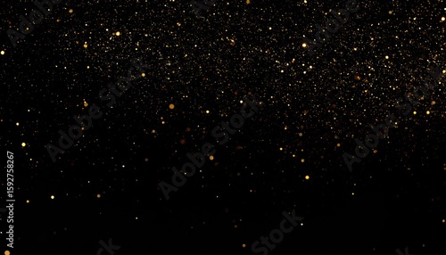 Golden glitter particles on a black background