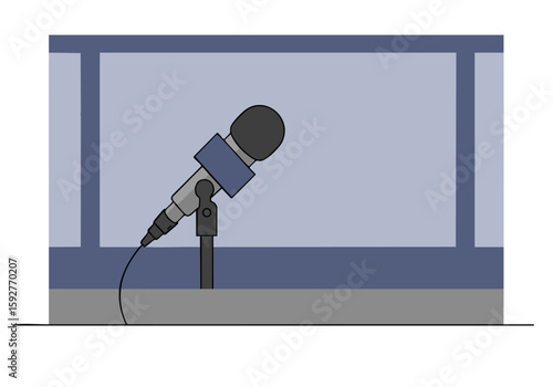 A microphone positioned in a studio set commentary booth. Clear, focused image with a professional setup. Suitable for broadcast and media visuals.