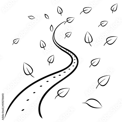 Winding road with dry leaves blowing in the autumn breeze  