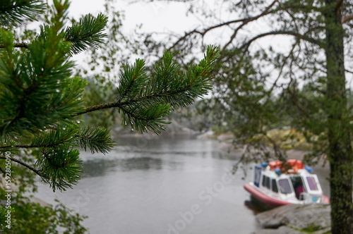 Beautiful scenery overlooking the skerries, rainy weather, and a docked boat