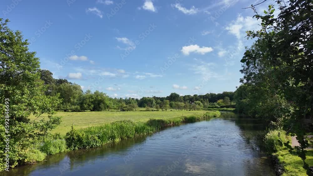 Lower Woodford Salisbury Wiltshire England UK. 08.07.2025. Video. The River Avon flowing through Lower Woodford towards Salisbury Wiltshire England UK Lower Woodford Salisbury Wiltshire England UK. 08.07.2025. Video. The River Avon flowing through Lower Woodford towards Salisbury Wiltshire England UK