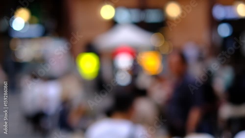 Wallpaper Mural A blurry image of a busy street with people and traffic lights. Scene is chaotic and bustling, with people walking and cars driving. The traffic lights are scattered throughout the scene Torontodigital.ca