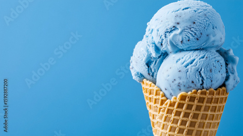 Wallpaper Mural Vibrant blue ice cream scoops stacked in a golden waffle cone Torontodigital.ca