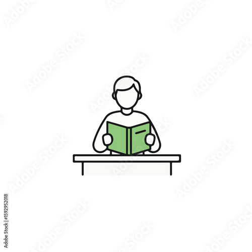A person diligently reading a book at a desk, focused on learning.