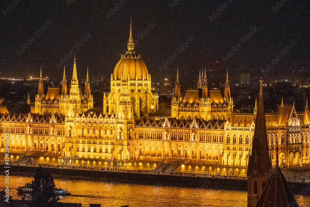 Obraz premium Budapest, Hungary - July 7, 2025: View of the city landmarks. Hungarian Parliament Building.