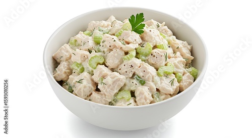 A classic chicken salad served in a round bowl, with shredded chicken, celery, mayo, and a sprinkle of herbs on top, on a plain white background.

