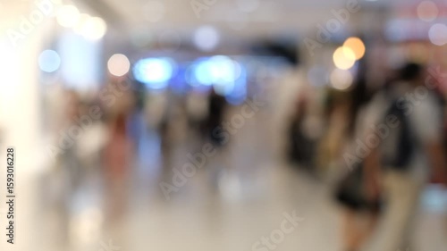 Wallpaper Mural A blurry image of a crowded mall with people walking around. Scene is busy and bustling, with people carrying backpacks and handbags Torontodigital.ca