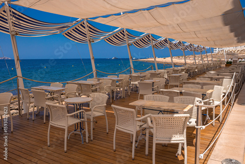 Tableau sur toile One of the cafes on the sea coast of Sant Antoni de Portmany - Ibiza, Balearic i