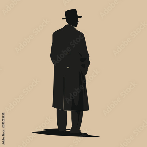 Silhouette of Man in Overcoat and Hat Standing Alone