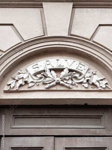 Pediment of an old building in light colors