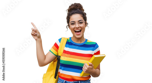 An excited young student with glasses and a colorful shirt points upwards while holding a book and backpack isolated on transparent background
