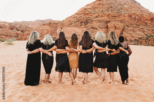group of women walking in the desert