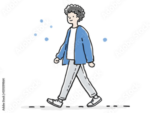 Young man with curly hair smiling while walking against a minimalistic background with soft blue dots, lifestyle concept of wellness or fitness