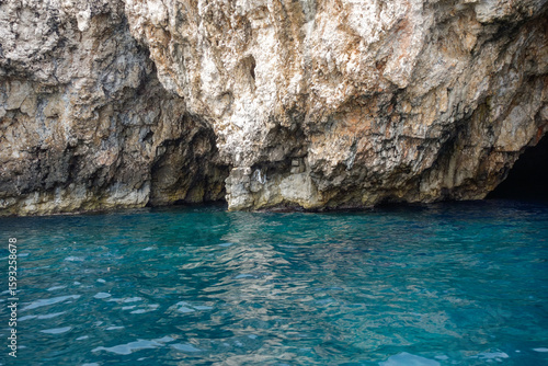 rock wall and turquoise waters in the Green cave in Vis island, Croatia