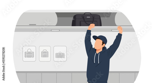 Passenger Putting Luggage Into Airplane Overhead Compartment On Flight