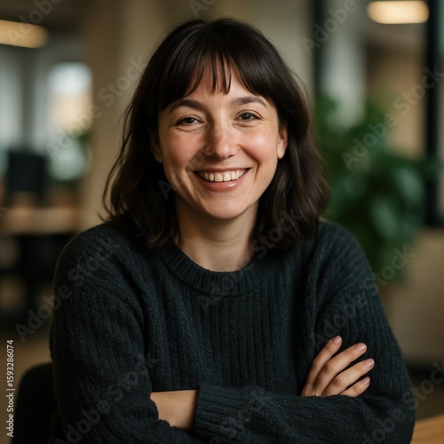 Young caucasian female smiling confidently in office environment