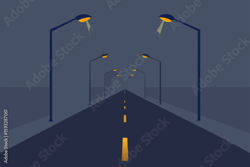 Empty road lined with streetlights at night