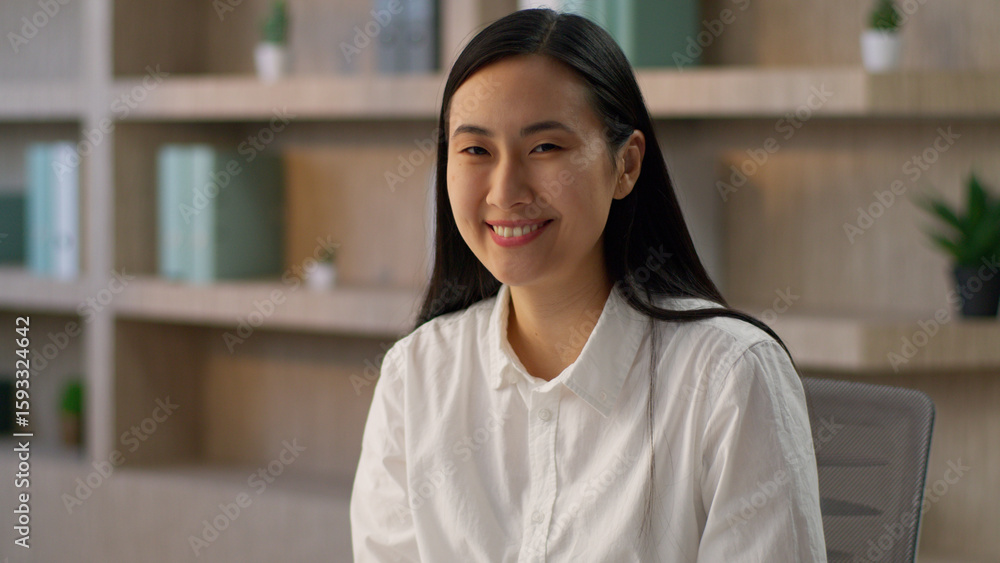Portrait gorgeous smiling Chinese businesswoman Asian girl worker happy Korean Japanese business woman female entrepreneur looking at camera friendly nodding head listening yes approve indoor office Portrait gorgeous smiling Chinese businesswoman Asian girl worker happy Korean Japanese business woman female entrepreneur looking at camera friendly nodding head listening yes approve indoor office