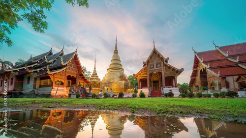 The golden temple reflects in the water in chiang mai, thailand