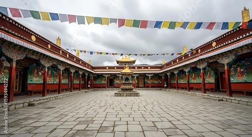 Vibrant Tibetan Monastery Courtyard with Golden Stupa Ornate Murals and Colorful Prayer Flags under Overcast Sky.