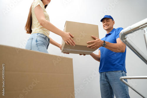 Young woman receiving parce...