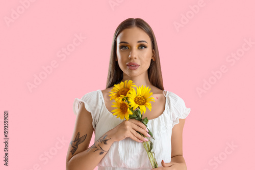 Young woman with bouquet of...
