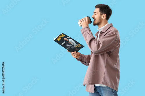 Young man with magazine dri...