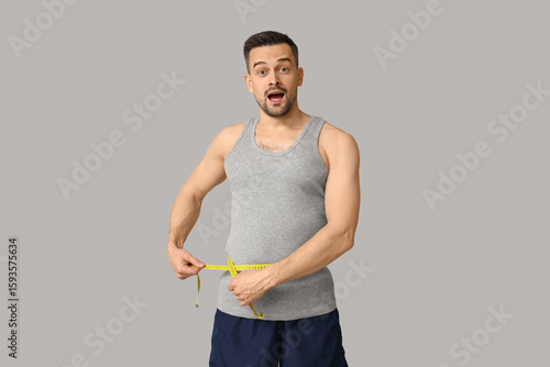 Handsome sporty shocked man...