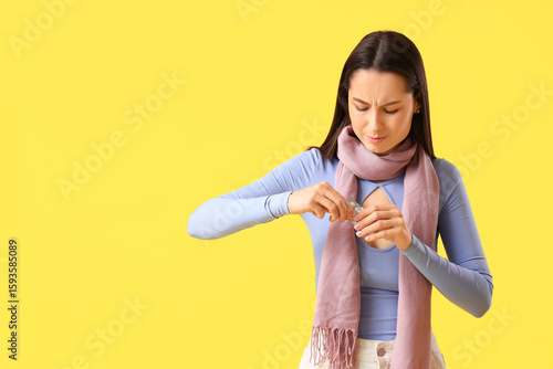 Young woman in scarf with p...