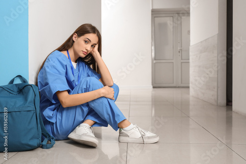 Tired female medical intern...