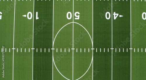 An Overhead View of an American Football Field Showing Yard Markers and the Center Circle
