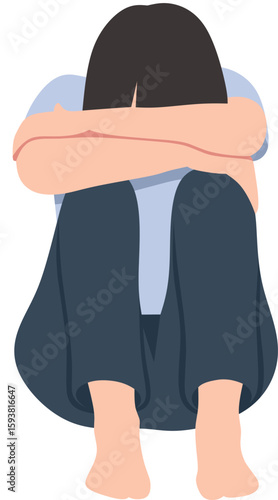 A depressed woman sits with her arms around her knees