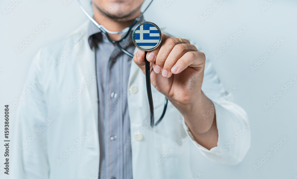 Obraz premium Greece national healthcare. Doctor showing stethoscope with Greece flag