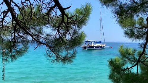 Serene Turquoise Waters: Yacht Anchored in a Picturesque Coastal Paradise