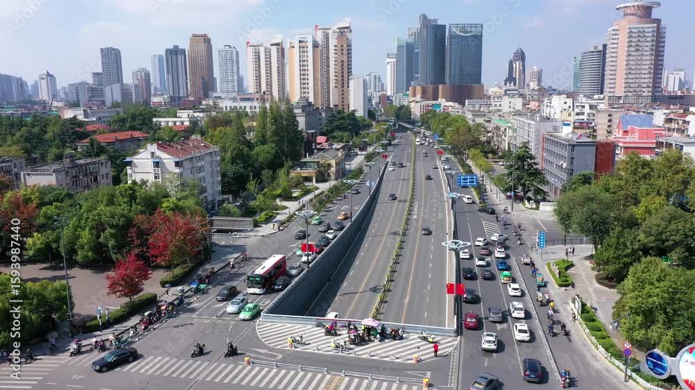Aerial view of traffic flow above major roads in Hefei during a sunny day