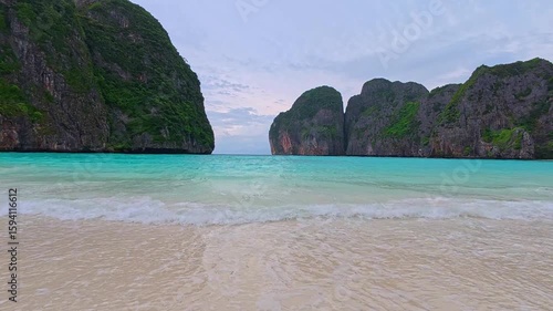 Soft wave of blue sea and sand on summer holidays beautiful beach as hyperlapse video