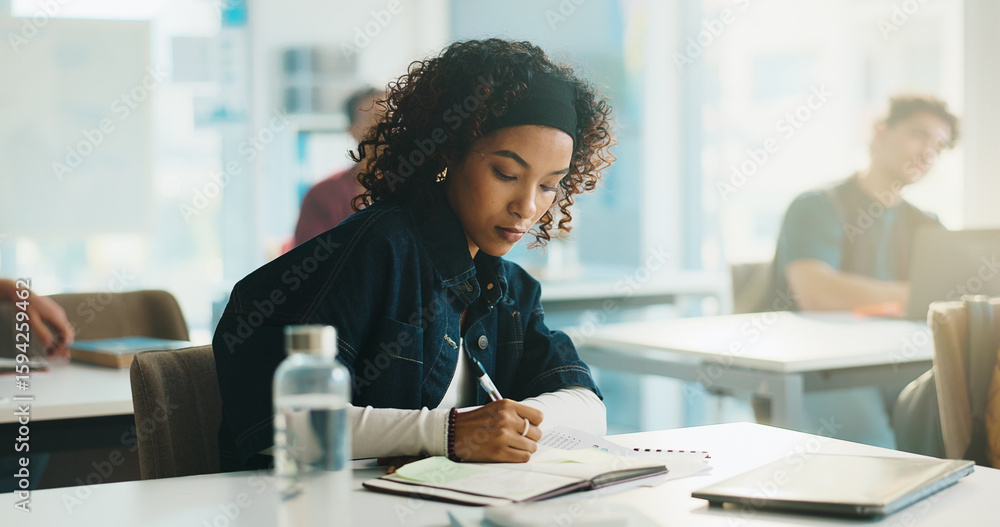 Obraz premium Woman, writing and book in classroom at college, study and development with education, info or knowledge. Person, university student and notes with project, learning and attention for scholarship